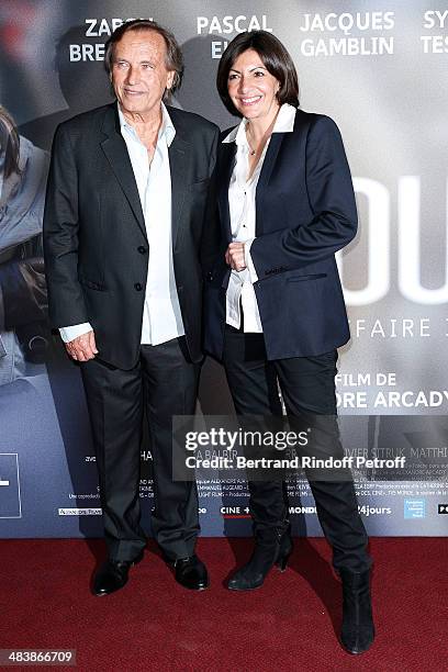 Mayor of Paris Anne Hidalgo and director of the movie Alexandre Arcady attend the '24 Jours' Paris Premiere at Cinema Gaumont Marignan on April 10,...