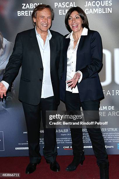 Mayor of Paris Anne Hidalgo and director of the movie Alexandre Arcady attend the '24 Jours' Paris Premiere at Cinema Gaumont Marignan on April 10,...