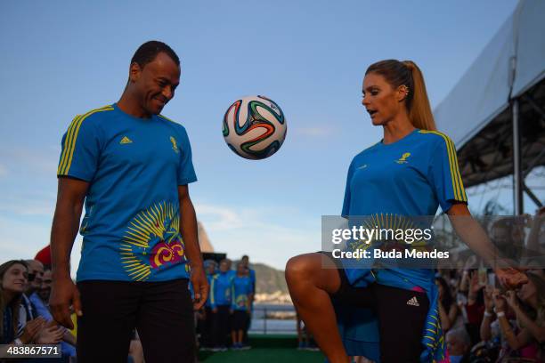 Brazilian former player Cafu and brazilian TV presenter and model Fernanda Lima walks the runway of Volunteers Uniform Launch - 2014 FIFA World Cup...