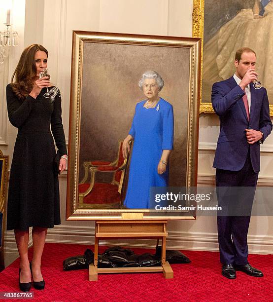 Catherine, Duchess of Cambridge and Prince William, Duke of Cambridge make a toast after unveiling a portrait of Queen Elizabeth II, painted by New...