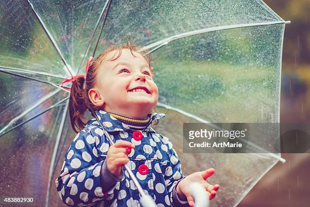 happy in rain - girl in shower stock pictures, royalty-free photos & images