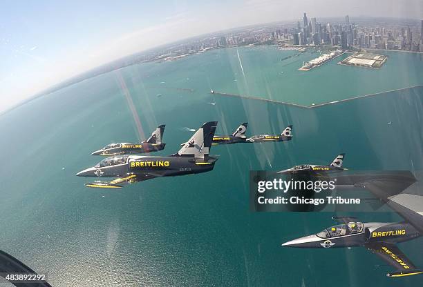 The Breitling Jet Team, made up of seven L-39C Albatros aircraft, fly over the lake front of Chicago during a media flight on Thursday, August 13...