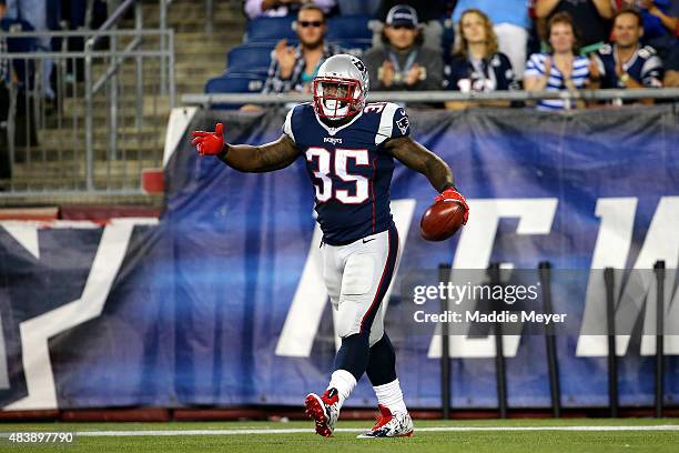 Jonas Gray of the New England Patriots celebrates after scoring a second quarter touchdown against the Green Bay Packers during a preseason game at...