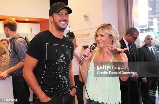 Luke Bryan takes a selfie with fans using the new Galaxy S6 edge+ at the AT&T store in New York to celebrate the unveiling of Samsungs newest...
