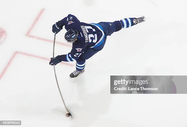 Eric Tangradi of the Winnipeg Jets shoots the puck during the pre-game warm up prior to NHL action against the Boston Bruins at the MTS Centre on...