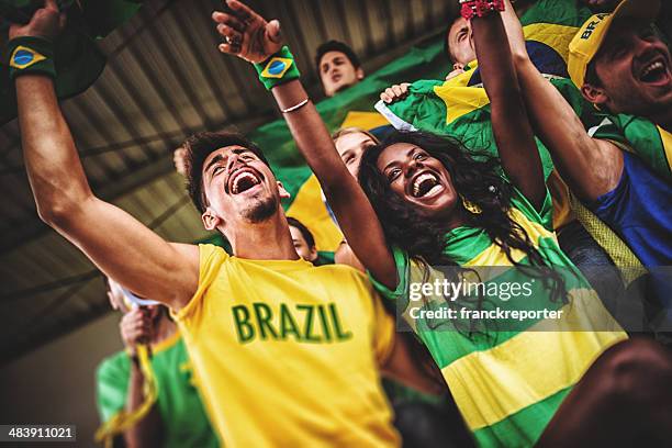 brazilian supporters at stadium - female fans brazil stock pictures, royalty-free photos & images