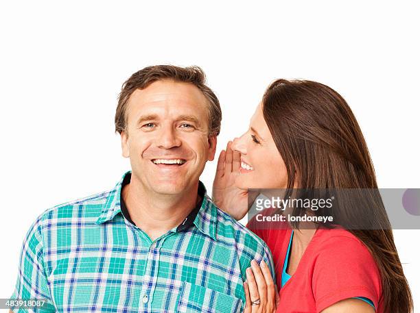 woman whispering secret - isolated - woman whisper to man stock pictures, royalty-free photos & images