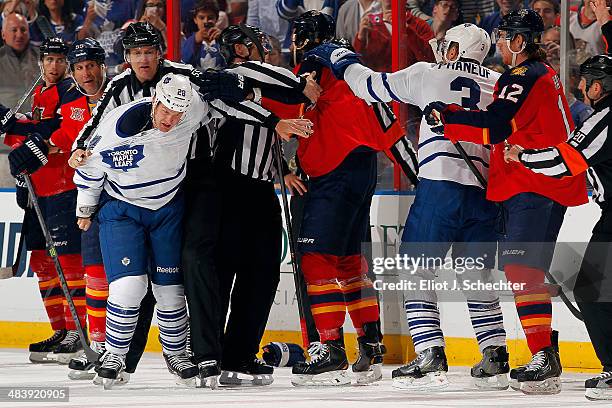 Linesmen separate Colton Orr of the Toronto Maple Leafs and Erik Gudbranson of the Florida Panthers during a second period altercation at the BB&T...