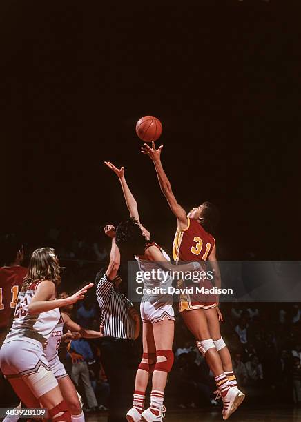 Cheryl Miller of the USC Trojans leaps for the tip off during an NCAA women's basketball game against Stanford University played during February 1983...