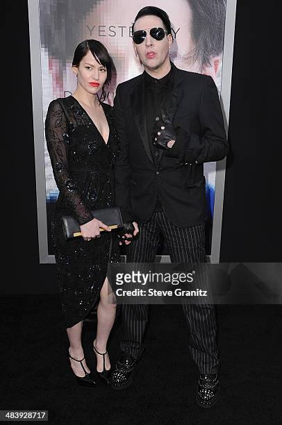 Lindsay Usich and musician Marilyn Manson attend the premiere of "Transcendence" at Regency Village Theatre on April 10, 2014 in Westwood, California.