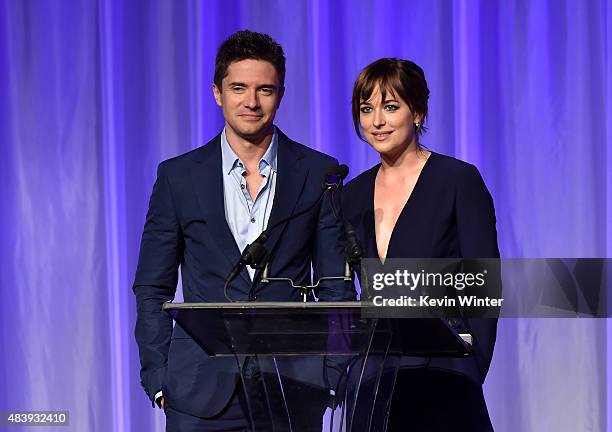 Actors Topher Grace and Dakota Johnson accept grant on behalf of LA County High School for the Arts, University of Illinois Ebertfest and Pablove...