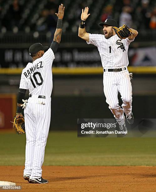 Adam Eaton of the Chicago White Sox leaps to celebrate with Alexei Ramirez after a win over the Cleveland Indians at U.S. Cellular Field on April 10,...