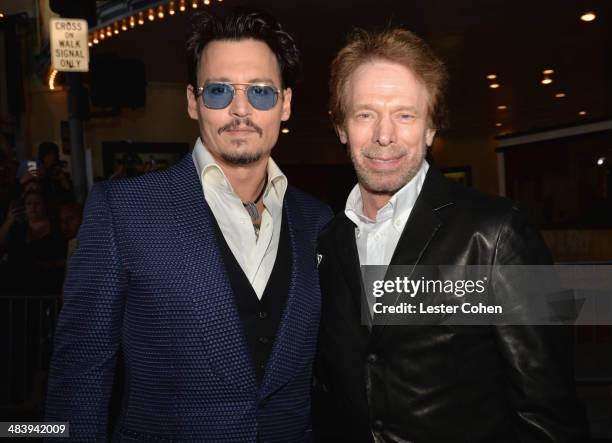 Actor Johnny Depp and producer Jerry Bruckheimer attend the premiere of Warner Bros. Pictures and Alcon Entertainment's "Transcendence" at Regency...