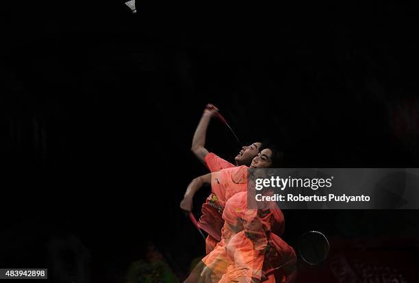 Wang Shixian of China competes against Carolina Marin of Spain in the quarter finals match of the 2015 Total BWF World Championship at Istora Senayan...