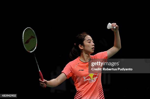 Wang Shixian of China competes against Carolina Marin of Spain in the quarter finals match of the 2015 Total BWF World Championship at Istora Senayan...