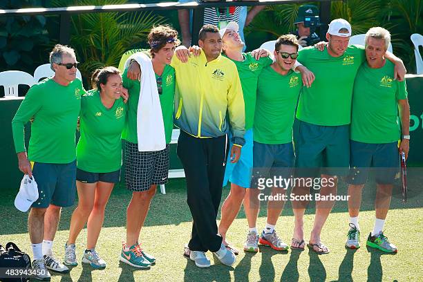 The Australian team including captain Wally Masur, John Millman, Sam Groth, Thanasi Kokkinakis and Nick Kyrgios look on as teammate Lleyton Hewitt of...
