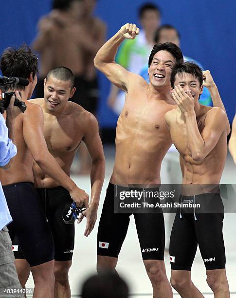 Takuro Fujii, Ranmaru Harada, Ryo Tateishi and Ryosuke Irie of Japan celebrate winning the gold medal in the Men's 400m Medley Relay during day six...