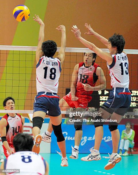 Yuta Yoneyama of Japan spikes the ball during the Men's Volleyball semi final match between South Korea and Japan during day twelve of the Guangzhou...