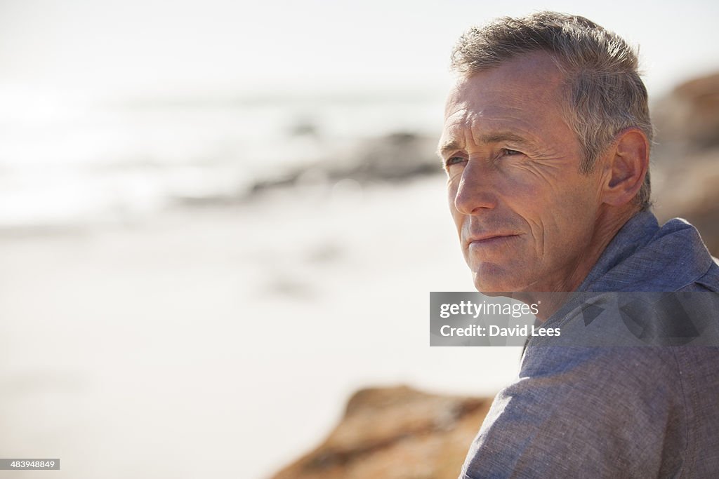 Close up of mature man relaxing on beach