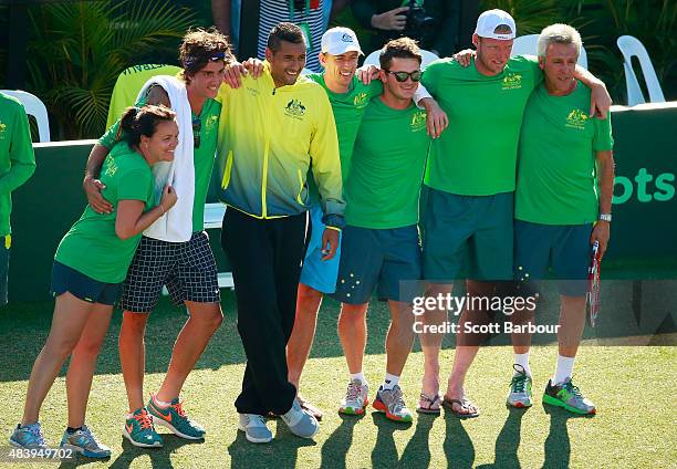 The Australian team including captain Wally Masur, John Millman, Sam Groth, Thanasi Kokkinakis and Nick Kyrgios look on as teammate Lleyton Hewitt of...