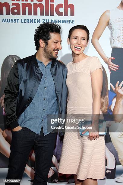 Fahri Yardim and Peri Baumeister attend the premiere of the film 'Irre sind maennlich' at Mathaeser Filmpalast on April 10, 2014 in Munich, Germany.