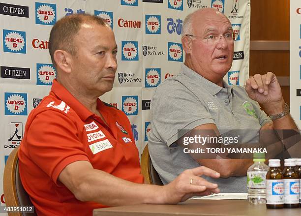 Assistant coach of World XV Andy Haden gestures as he answers questions beside head coach of Japanese national team Eddie Jones during their press...