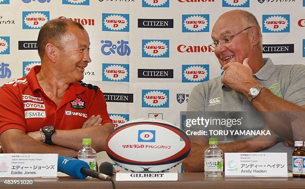 Assistant coach of World XV Andy Haden chats with head coach of Japanese national team Eddie Jones during their press conference in Tokyo on August...