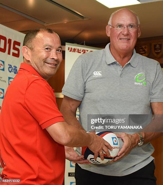 Assistant coach of World XV Andy Haden and head coach of Japanese national team Eddie Jones pose for photographers during their press conference in...