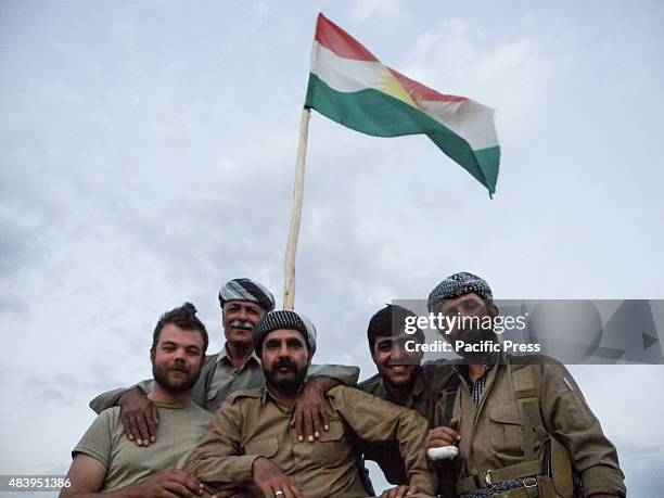 Volunteer members of PDKI taking their photo in the flag pole. They joined as volunteers with PDK-I in the north of Iran at the border of Iraq-Iran...