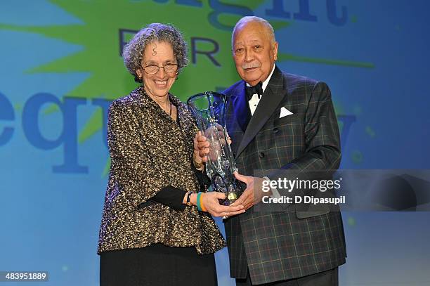 President of American Jewish World Service, Ruth Messinger accepts her award from Former Mayor of New York David Dinkins at the PFLAG National...