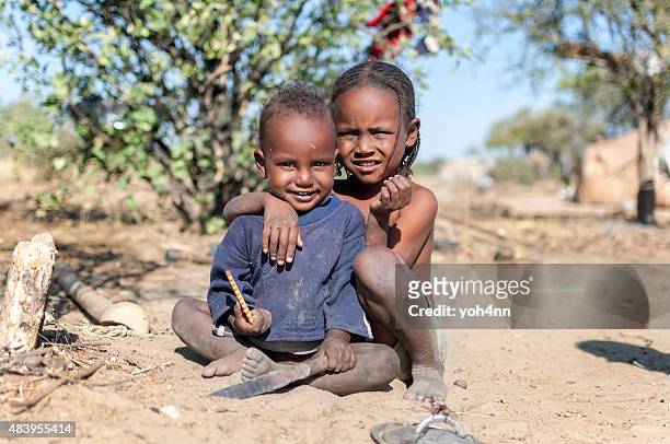 african boy and girl - famine stockfoto's en -beelden