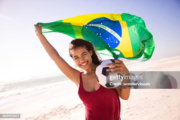 cheering girl football fan with brazilian flag - brazil girls supporters stock pictures, royalty-free photos & images