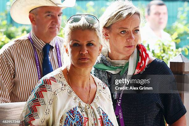 Corinna Schumacher, wife of former German Formula One driver Michael Schumacher, watches their daughter Gina present the elements of the reining...