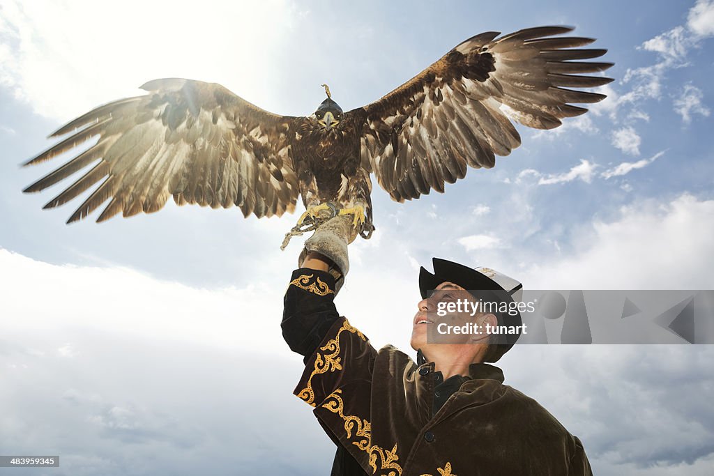 Traditional Kyrgyz Hunter Holding Eagle