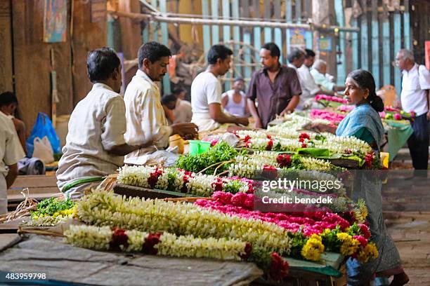 flower garland makers and vendors meenakshi amman temple madurai india - madurai meenakshi sundareswarar temple stock pictures, royalty-free photos & images