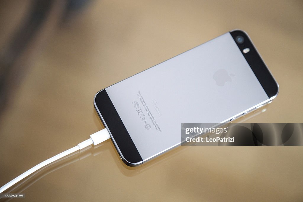 Apple Iphone 5s Backside And Charger Cable High-Res Stock Photo