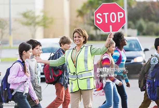 school crossing guard - lollipop lady stock pictures, royalty-free photos & images