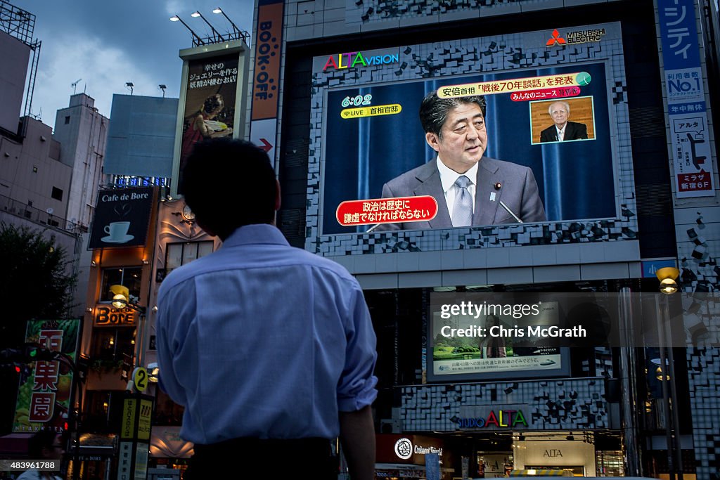 Japanese Watch As Abe Reads Out WWII Statement Before The WWII Surrender Anniversary