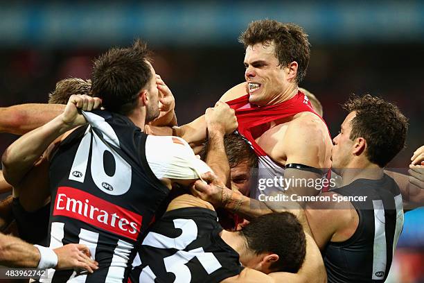 Nathan Brown of the Magpies has an altercation with Mike Pyke of the Swans during the round 20 AFL match between the Sydney Swans and the Collingwood...