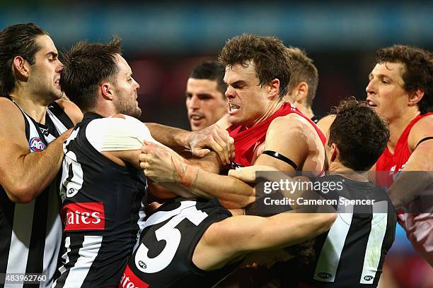 Nathan Brown of the Magpies has an altercation with Mike Pyke of the Swans during the round 20 AFL match between the Sydney Swans and the Collingwood...