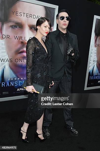 Lindsay Usich and musician Marilyn Manson attend the premiere of Warner Bros. Pictures and Alcon Entertainment's "Transcendence" at Regency Village...