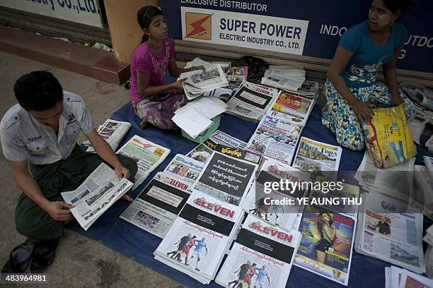 Newspapers with a black front page are displayed at a stall in Yangon on April 11 after Zaw Pe, a journalist for the Democratic Voice of Burma news...