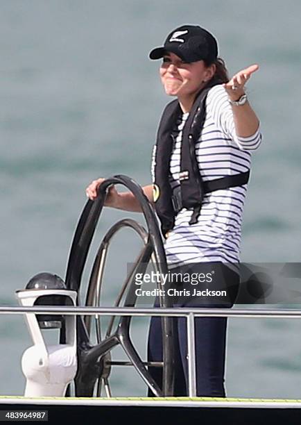 Catherine, Duchess of Cambridge gestures to Prince William, Duke of Cambridge as she helms an America's Cup yacht as she races Prince William, Duke...