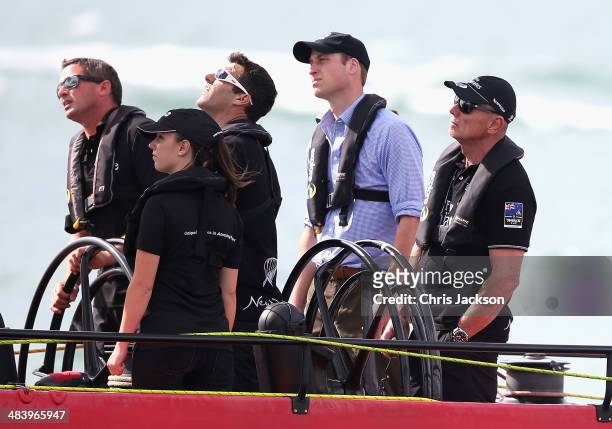 Prince William, Duke of Cambridge helms an America's Cup yacht as he races Catherine, Duchess of Cambridge in Auckland Harbour on April 11, 2014 in...