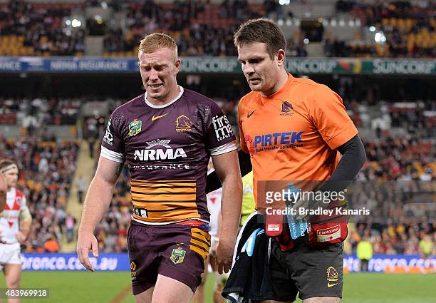 Jack Reed of the Broncos is taken from the field after receiving a head knock during the round 23 NRL match between the Brisbane Broncos and the St...