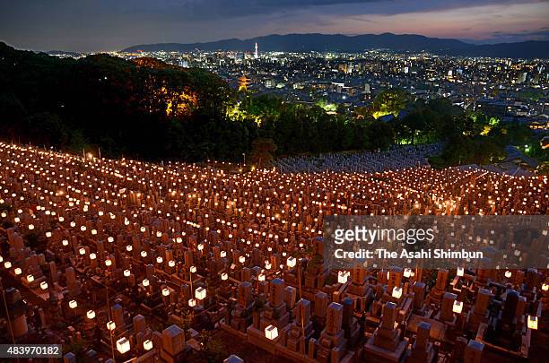 Candle-lit lanterns are placed during the 'Higashi Otani Mantoe' at Otani Sobyo Mausoleum on August 14, 2015 in Kyoto, Japan. The event started in...