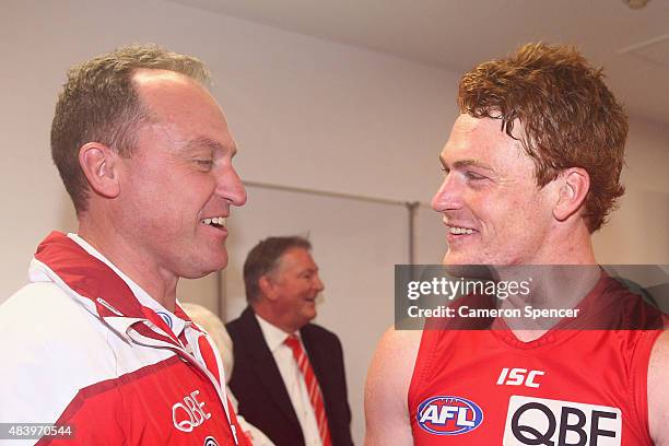 Swans coach John Longmire and Gary Rohan of the Swans smile after winning the round 20 AFL match between the Sydney Swans and the Collingwood Magpies...