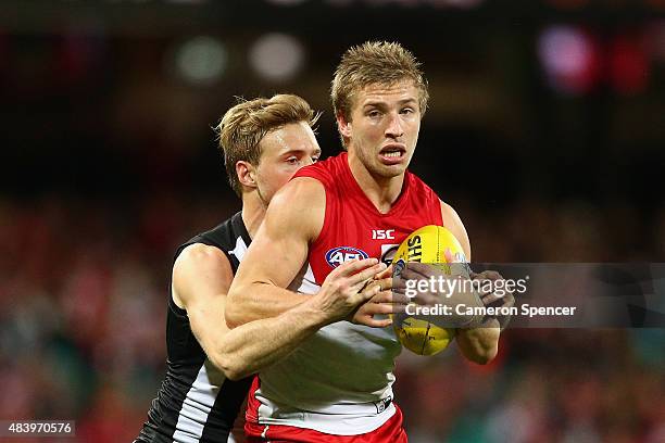 Kieren Jack of the Swans is tackled during the round 20 AFL match between the Sydney Swans and the Collingwood Magpies at SCG on August 14, 2015 in...