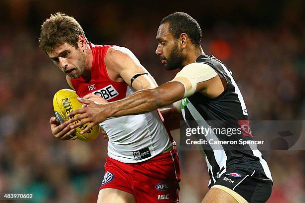 Nick Smith of the Swans is tackled during the round 20 AFL match between the Sydney Swans and the Collingwood Magpies at SCG on August 14, 2015 in...