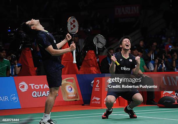 Hiroyuki Endo and Kenichi Hayakawa of Japan react after defeating Angga Pratama and Ricky Karanda Suwardi of Indonesia in the quarter final match of...